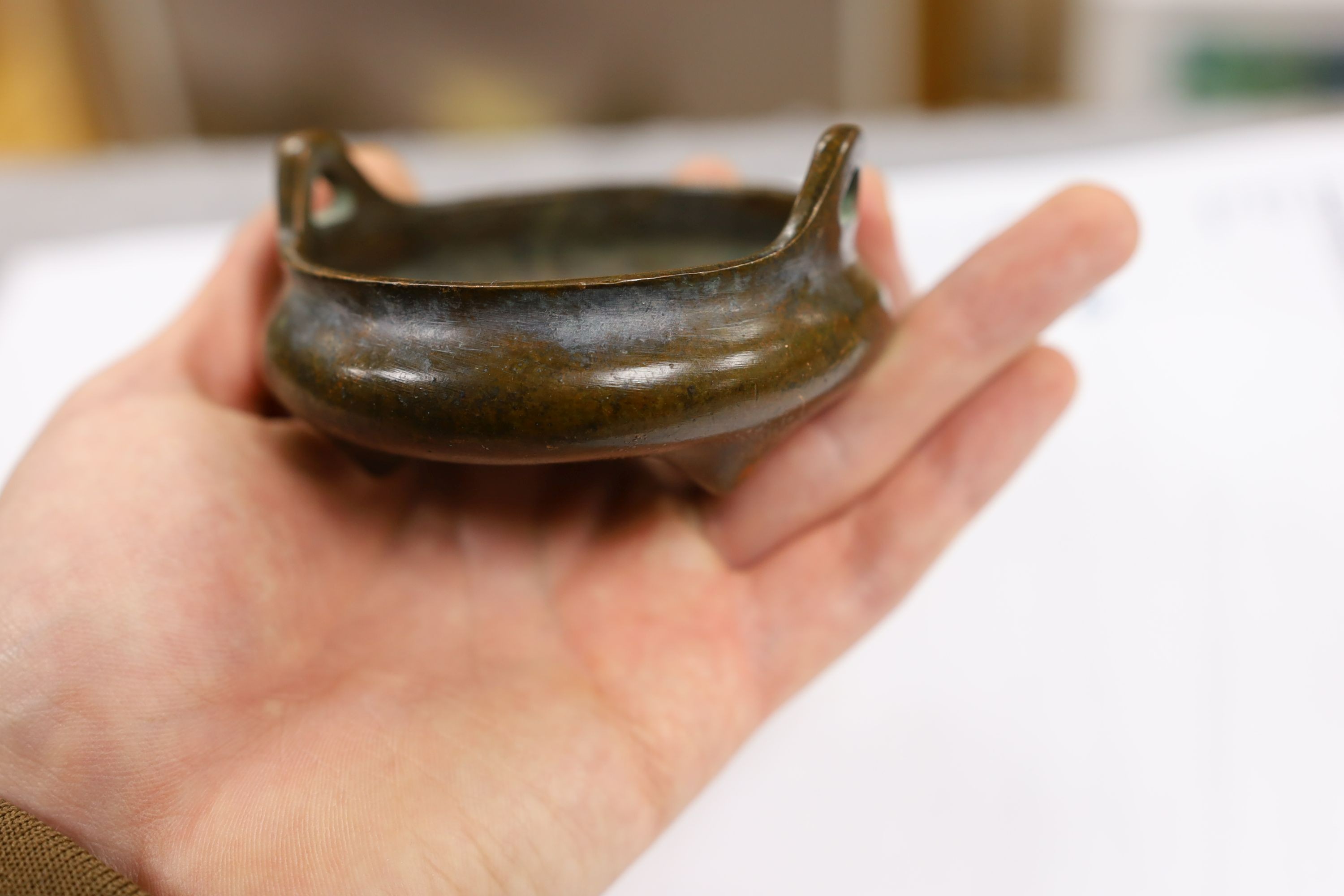 Two Chinese bronze censers, largest 11cms diameter
